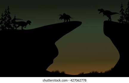 Silhouette of Triceratops and Allosaurus in the cliff