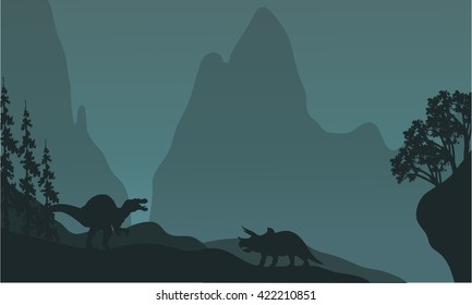 Silhouette of triceratops and spinosaurus at the night