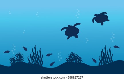 Silhouette of turtle fish and reef landscape