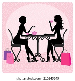 Silhouette Of Two Beautiful Girls Talking In A Cafe 