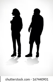 silhouette of two boys looking on one side
