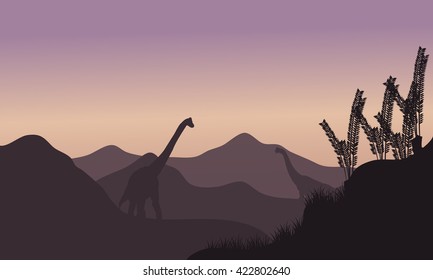 Silhouette of two brachiosaurus in fields at the morning