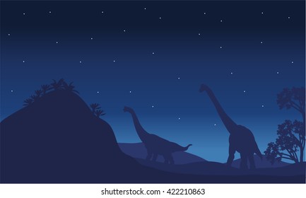 Silhouette of two brachiosaurus with star and blue backgrounds