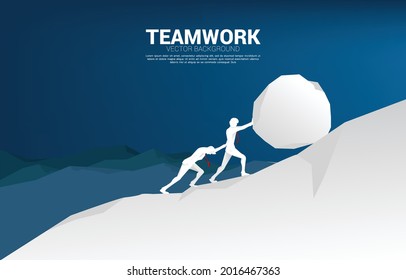 Silhouette of two businessman pushing the big rock to the top of mountain. concept of business challenge and hard work.