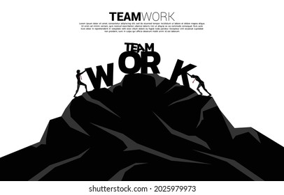 Silhouette of two businessman pushing the wording teamwork to the top of mountain. concept of business challenge and teamwork.