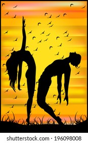 Silhouette of two dancers at sunset 