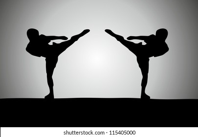 Silhouette of two fighters