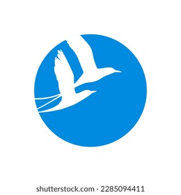 Silhouette of the two flying white-tailed tropicbirds in blue circle. Vector illustration.