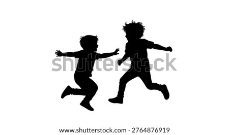 Silhouette of two kids running together