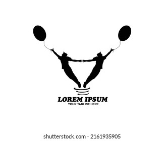 Silhouette of two little children holding balloons