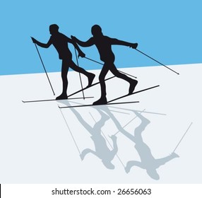 Silhouette of two nordic skiers