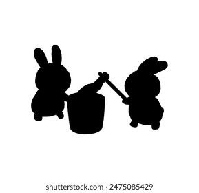 Silhouette of two rabbits pounding mochi.