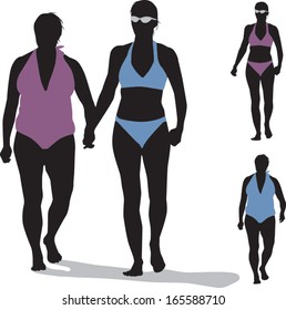 Silhouette of two women wearing bathing suits and holding hands.