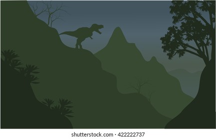 Silhouette of tyrannosaurus in cliff with green backgrounds