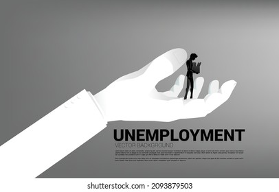 silhouette of Unemployment man walking in big hand. Concept for end of career and jobless.