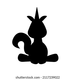 The silhouette of a unicorn sits