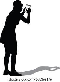 Silhouette vector of back view of standing young beautiful woman using a mobile phone. girl watching. Rear view people collection. backside view of person. Isolated over white background.