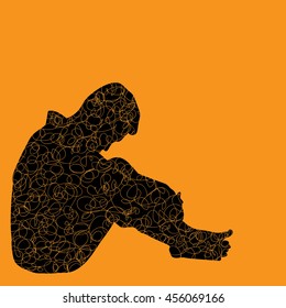 Silhouette of Very sad young man sitting alone on yellow background