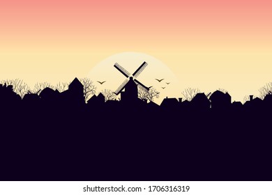 silhouette of a village with a mill. Dawn of the sun. Vector