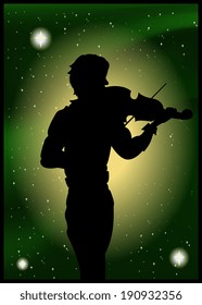Silhouette of violinist on the background of the beautiful starry sky 