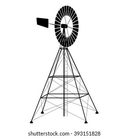 silhouette of a water pumping old windmill, windmill water tower