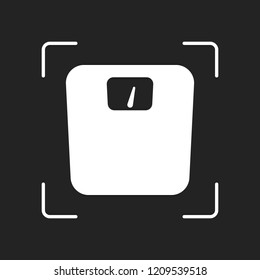 silhouette of weights, simple symbol. White object in camera autofocus on dark background