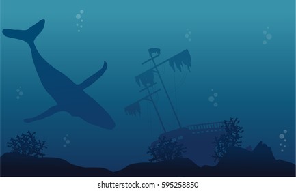 Silhouette of whale and ship underwater landscape