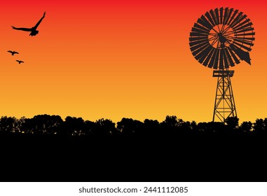 silhouette of windmill and gum tree, three birds flying in the sunset