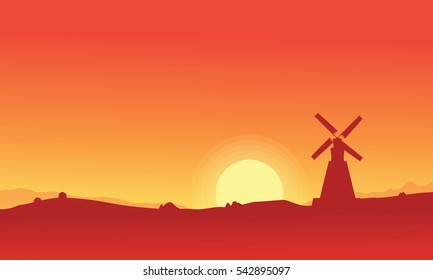 Silhouette of windmill on orange backgrounds