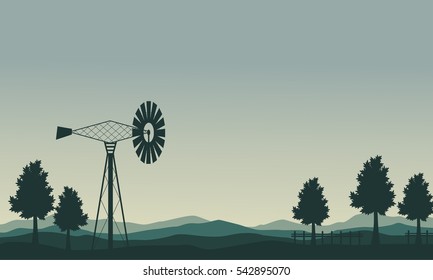 Silhouette of windmill and tree scenery