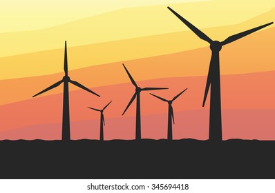 silhouette windmills on the sunset