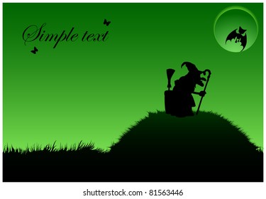 Silhouette of a witch in a cap that is on a hill with a crutch under the full moon