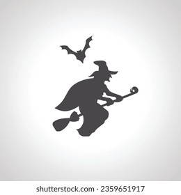 silhouette of a witch flying on a broom with bat