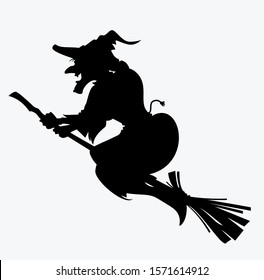 silhouette of a witch flying on a broomstick