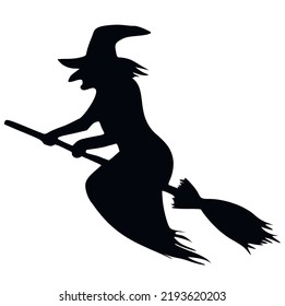 Silhouette of a witch on a broomstick in flight