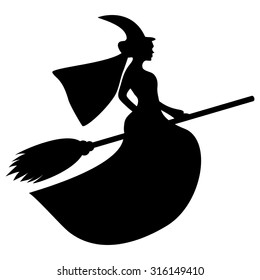 silhouette of a witch on a broomstick on Halloween