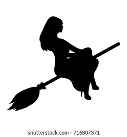 silhouette of a witch on a broomstick on Halloween