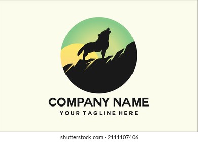 silhouette of a wolf on a hill