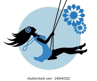 silhouette of a woman in a blue dress on a swing