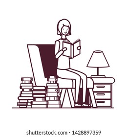 silhouette of woman with book in hands in living room