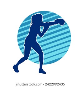 Silhouette of woman boxing athlete in action pose. Silhouette of a female wearing boxing gloves for boxing sport.