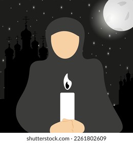 Silhouette of a woman in a cassock with candle in her hands on night sky background with stars, church and moon. A nun with a lighted candle. Easter concept. The person in the apostolic.