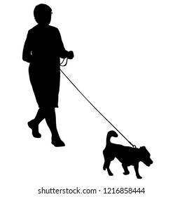 Silhouette of woman and dog on a white background