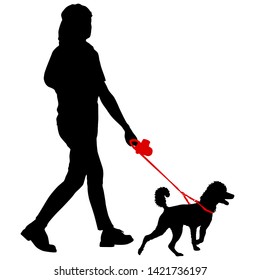 Silhouette of woman and dog on a white background