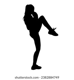 Silhouette of a woman doing aerobic move. Silhouette of a gym sporty person doing warming up workout.