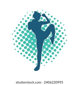 Silhouette of a woman doing a martial art kick. Silhouette of a sporty female doing kicking movement.
