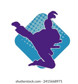 Silhouette of a woman doing a martial art kick. Silhouette of a sporty female doing kicking movement.