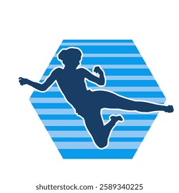 Silhouette of a woman doing a martial art kick. Silhouette of a sporty female doing kicking movement.