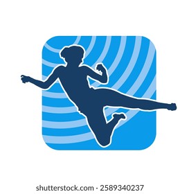 Silhouette of a woman doing a martial art kick. Silhouette of a sporty female doing kicking movement.