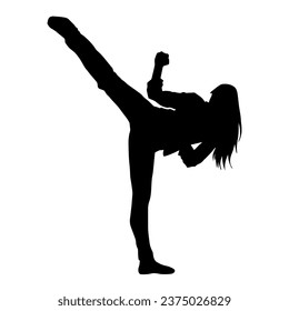 Silhouette of a woman kicking pose. Silhouette of a female martial art in action pose.